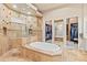 Luxurious main bathroom features a soaking tub, walk-in shower, and and walk-in closet at 6808 Belmont Ct, Lakewood Ranch, FL 34202