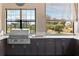 Outdoor kitchen with grill, countertop, and dark cabinetry at 6808 Belmont Ct, Lakewood Ranch, FL 34202