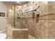 Luxurious shower with dual shower heads and decorative tile create a spa-like retreat at 6808 Belmont Ct, Lakewood Ranch, FL 34202
