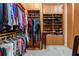 Spacious walk-in closet with custom built-in shelving and ample storage space at 6808 Belmont Ct, Lakewood Ranch, FL 34202