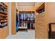 Spacious walk-in closet with custom built-in shelving and ample storage space at 6808 Belmont Ct, Lakewood Ranch, FL 34202
