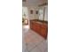 Bathroom featuring a granite countertop and a cherry wood vanity cabinet at 7004 Mauna Loa Blvd, Sarasota, FL 34241