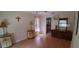 Well-lit bedroom featuring laminate floors and a dresser for ample storage at 7004 Mauna Loa Blvd, Sarasota, FL 34241