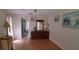 Bright bedroom with a wooden dresser and decor with a view of an attached bathroom at 7004 Mauna Loa Blvd, Sarasota, FL 34241