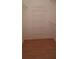 Walk-in closet featuring built-in wire shelving and laminate flooring at 7004 Mauna Loa Blvd, Sarasota, FL 34241
