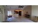 Open dining area with tile flooring, dark wood table and sliding glass doors to the backyard at 7004 Mauna Loa Blvd, Sarasota, FL 34241