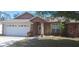 Charming single-story home featuring a two-car garage and a well-maintained front lawn at 7004 Mauna Loa Blvd, Sarasota, FL 34241
