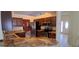 Kitchen featuring granite countertops, stainless steel appliances and dark wood cabinets at 7004 Mauna Loa Blvd, Sarasota, FL 34241