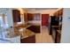 A kitchen featuring granite countertops, stainless steel appliances and dark wood cabinets at 7004 Mauna Loa Blvd, Sarasota, FL 34241