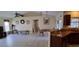 Bright, open living space featuring neutral walls, ceiling fan, and an adjacent kitchen space at 7004 Mauna Loa Blvd, Sarasota, FL 34241