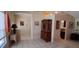 Open living room with tile floors and a view to the kitchen and dining area at 7004 Mauna Loa Blvd, Sarasota, FL 34241