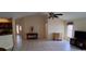 Open living room featuring neutral tones, tile flooring, and natural light throughout at 7004 Mauna Loa Blvd, Sarasota, FL 34241