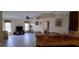 Open-concept layout with granite countertops, ceiling fan, and tile floors at 7004 Mauna Loa Blvd, Sarasota, FL 34241
