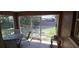Enclosed sunroom with views of the backyard, perfect for relaxation and outdoor enjoyment at 7004 Mauna Loa Blvd, Sarasota, FL 34241
