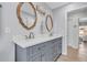 Elegant bathroom features a double sink vanity with stylish mirrors, modern lighting, and neutral tones at 7205 Pointe West Blvd, Bradenton, FL 34209