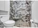 Stylish bathroom features a tiled shower with a seat, hexagon tile floor, and glass door at 7205 Pointe West Blvd, Bradenton, FL 34209