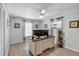 Bright bedroom features wood-look flooring, a ceiling fan, and modern decor at 7205 Pointe West Blvd, Bradenton, FL 34209