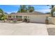 Charming single-story home featuring a two-car garage, stone accents and a beautifully landscaped yard at 7205 Pointe West Blvd, Bradenton, FL 34209