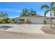 Charming single-story home featuring a two-car garage, stone accents and a beautifully landscaped yard at 7205 Pointe West Blvd, Bradenton, FL 34209