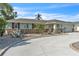 Charming single-story home featuring a two-car garage, stone accents and a beautifully landscaped yard at 7205 Pointe West Blvd, Bradenton, FL 34209