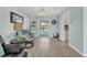 Bright living room with a pool view and charming coastal decor creating a relaxing atmosphere at 7205 Pointe West Blvd, Bradenton, FL 34209