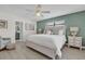 Cozy main bedroom featuring neutral tones, ensuite bathroom, and bright natural light at 7205 Pointe West Blvd, Bradenton, FL 34209