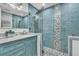 Custom tiled shower with glass door, rain shower head, and mosaic tile accents at 7205 Pointe West Blvd, Bradenton, FL 34209