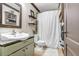 This rustic bathroom features built-in shelving and tiled floors at 7321 Caladesia Dr, Sarasota, FL 34243