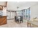 Bright dining area with a full wall of storage, large windows, and rustic accents at 7321 Caladesia Dr, Sarasota, FL 34243