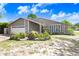 Charming single-Gathering home with stone accents, a two-car garage and lush landscaping at 7321 Caladesia Dr, Sarasota, FL 34243