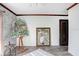 Bright room featuring wall art, a large window, and gray laminate flooring at 7321 Caladesia Dr, Sarasota, FL 34243