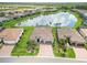 Aerial view of a single-Gathering home in a community featuring a lake in the backyard at 7327 Summerland Cv, Bradenton, FL 34202