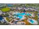 Aerial view of the community showcasing the large pool area, clubhouse, and surrounding greenery at 7327 Summerland Cv, Bradenton, FL 34202