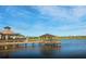 Beautiful lakeside clubhouse features a covered pier, scenic views, and outdoor seating at 7327 Summerland Cv, Bradenton, FL 34202