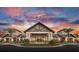 Exterior shot of community clubhouse with meticulous landscaping and a welcoming entrance at 7327 Summerland Cv, Bradenton, FL 34202
