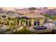 Outdoor view of the luxurious lakeside clubhouse with ample seating and lush landscaping at 7327 Summerland Cv, Bradenton, FL 34202