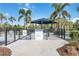 Community dog park featuring separate areas for large and small dogs, shade, and green space at 7327 Summerland Cv, Bradenton, FL 34202