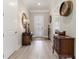 Elegant entryway featuring hardwood flooring and accent furnishings at 7327 Summerland Cv, Bradenton, FL 34202