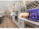 Well-equipped kitchen with stainless appliances and custom cabinetry including a wine rack at 7327 Summerland Cv, Bradenton, FL 34202