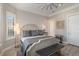 Bright and airy main bedroom with a beautiful bed, ceiling fan, and plantation shutters at 7327 Summerland Cv, Bradenton, FL 34202