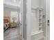 Charming mud room with integrated coat rack, cubbies, bench and view to the bedroom at 7327 Summerland Cv, Bradenton, FL 34202