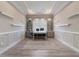 Bright office features custom built-ins, floating shelves and a decorative tray ceiling at 7327 Summerland Cv, Bradenton, FL 34202