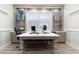 Spacious office features custom built-ins and a large window for natural light at 7327 Summerland Cv, Bradenton, FL 34202