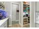 Walk-in pantry offering ample storage space with custom shelving and easy access at 7327 Summerland Cv, Bradenton, FL 34202