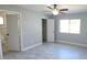 Spacious bedroom with tile flooring, a ceiling fan, and natural light at 7524 Kavanda St, North Port, FL 34287