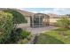 Charming backyard featuring a screened-in patio and well-maintained landscaping at 7632 Quinto Dr, Sarasota, FL 34238