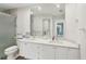 Bathroom with dual sinks, vanity and large mirror at 7632 Quinto Dr, Sarasota, FL 34238