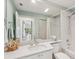 The bathroom boasts a vanity with a large mirror and a shower/tub combo at 7632 Quinto Dr, Sarasota, FL 34238
