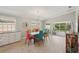 Elegant dining room features modern lighting, neutral decor, and outdoor access at 7632 Quinto Dr, Sarasota, FL 34238
