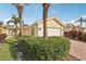 Exterior view of home with well-maintained landscaping at 7632 Quinto Dr, Sarasota, FL 34238